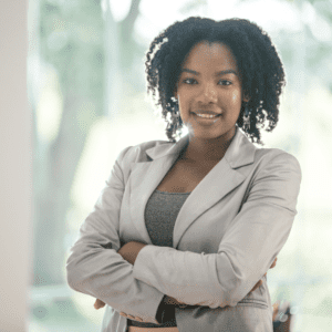 Confident woman standing with arms crossed